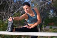 Stretching after running (Image via Pexels/Nathan Cowley)